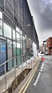 an empty street in front of a building at Saint Saviour's Apt Waterford in Waterford