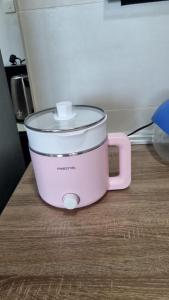 a pink slow cooker sitting on top of a counter at Noble Vivacity Jazz 2 Cozy Homestay in Kuching