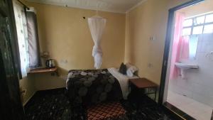 Ένα ή περισσότερα κρεβάτια σε δωμάτιο στο Premara Hotel Kehancha
