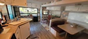 an rv kitchen with a sink and a counter at Logan Martin Lake Sunroom in Lincoln
