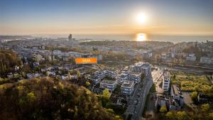 an aerial view of a city at sunset at Apartamenty Sun & Snow Silva in Gdynia