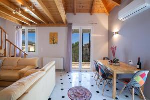 a living room with a couch and a table at Casa Hara2 in Lefkada Town