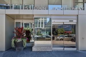 a building with glass doors and flowers in front of it at GLOBALSTAY New Fabulous Toronto Condo in Toronto