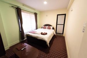 Letto o letti in una camera di Yeti Cozy Hotel