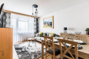 a living room with a couch and a table at Apartament Regionalny Centrum in Zakopane