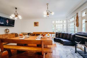 a living room with a table and a couch at Knyazheska Banya in Sofia