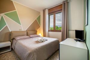 Postel nebo postele na pokoji v ubytování Apartment Corina Cavallino Treporti