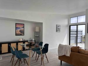 a living room with a table and chairs and a couch at 30 PCT OFF!! Limited Time! Malibu Ocean Wave with King Bed, Walking to Beach and Hiking in Malibu
