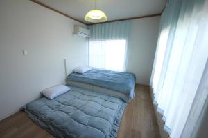 Postel nebo postele na pokoji v ubytování Karwan House