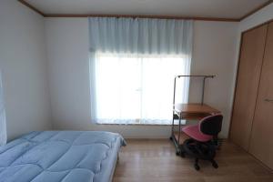 Postel nebo postele na pokoji v ubytování Karwan House