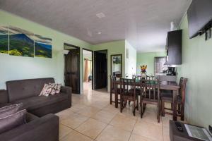 a living room with a couch and a table at Vacation Home Bartenderluisch in Fortuna