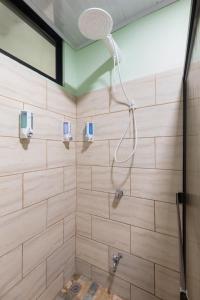 a bathroom with a shower with wooden walls at Vacation Home Bartenderluisch in Fortuna