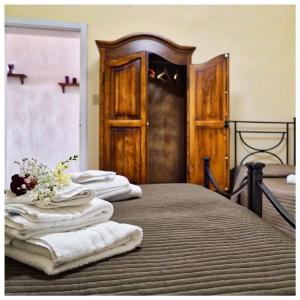 Un pat sau paturi într-o cameră la B&b Il Piccolo Paradiso