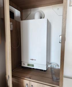 a wii system sitting on top of a cabinet at Casa Maria in Vama Veche