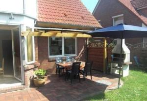 Fotografie z fotogalerie ubytování Großzügige Ferienwohnung mit Privatgarten im Nordseebad Carolinensiel v destinaci Wittmund