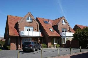 Fotografie z fotogalerie ubytování Großzügige Ferienwohnung mit Privatgarten im Nordseebad Carolinensiel v destinaci Wittmund + 2 fotografie
