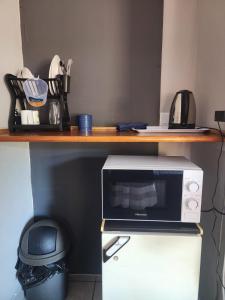 a microwave sitting on top of a counter at Sweet Dreams Polokwane in Polokwane
