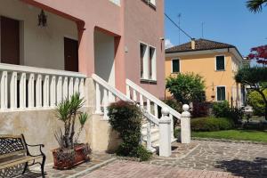 a bench sitting in front of a house at Apartment deluxe ground floor Venice/Treviso park in Silea