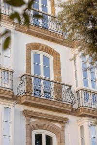a balcony on the side of a building at Candelaria10 in Cádiz