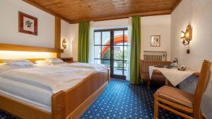 Postel nebo postele na pokoji v ubytování Hotel Alpina