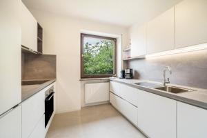 Kuchyň nebo kuchyňský kout v ubytování Villa Pinie Apt 2