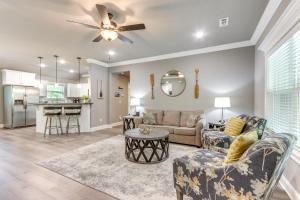a living room with a couch and a table at Eureka Springs Family Home - half Mi to Marina! in Eureka Springs