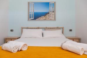 Postel nebo postele na pokoji v ubytování Sa Dommu e Mare