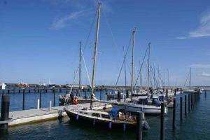 a group of boats docked at a dock in the water at Bel Etage in der Villa Amelie am M in Sassnitz