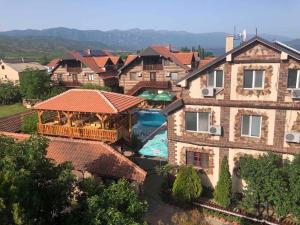 an aerial view of a large house with a swimming pool at Apartments Dan Dar in Nov Dojran