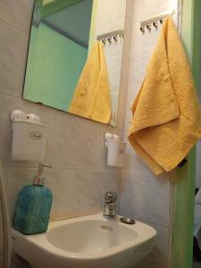 a bathroom with a sink and a mirror at PRIVATE SEASIDE GUEST HOUSE... in Agia Marina Mikrolimanou +36 photos