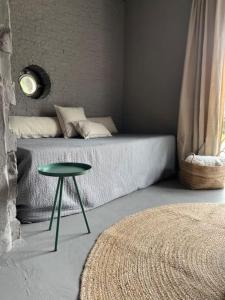 Кровать или кровати в номере Lakeside Studio – Haus mit Seezugang