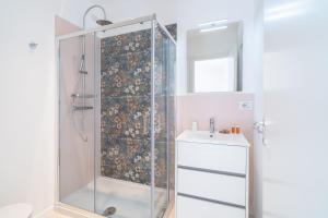 a bathroom with a shower and a sink at Dimore delle Zagare Molo in Syracuse