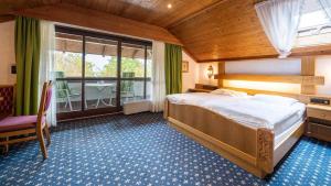Postel nebo postele na pokoji v ubytování Hotel Alpina