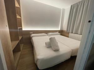 Posteľ alebo postele v izbe v ubytovaní Apartamentos La Solana