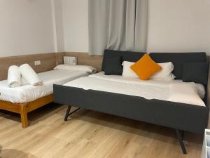 Posteľ alebo postele v izbe v ubytovaní Apartamentos La Solana
