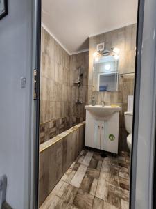 a bathroom with a sink and a toilet at luxury two bedroom Crown Apartament in Pravets +27 photos