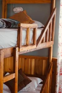 two sets of bunk beds in a room at Wake In Himalayas in Pelling