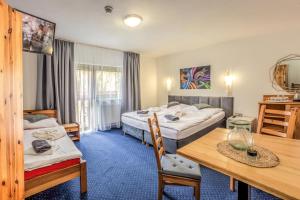 Posteľ alebo postele v izbe v ubytovaní Wellness & Restaurant U Fandy + 37 fotografií