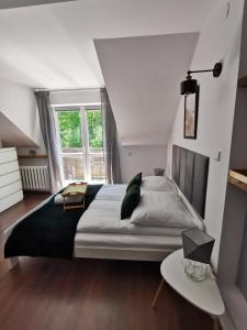 Postel nebo postele na pokoji v ubytování Srokówka Resort