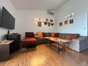 a living room with a couch and a table at Villa Galatea in Utjeha +8 photos