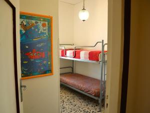 A bed or beds in a room at La Terrazza Incantata - ASCENSORE DIRETTO IN SPIAGGIA