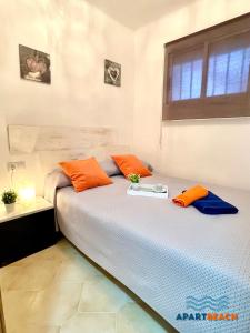 A bed or beds in a room at APARTBEACH DMS I 217 Vistas Playa y Climatizado