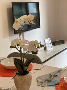 A television and/or entertainment centre at APARTBEACH DMS I 217 Vistas Playa y Climatizado