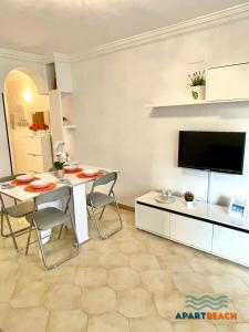 A television and/or entertainment centre at APARTBEACH DMS I 217 Vistas Playa y Climatizado