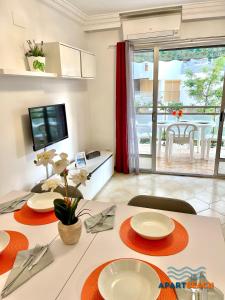 A television and/or entertainment centre at APARTBEACH DMS I 217 Vistas Playa y Climatizado