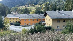 a group of buildings in a village with trees at Ferienwohung Husky in Nauders