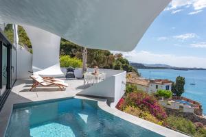 a villa with a swimming pool and a view of the ocean at RentitSpain Casa Acantilado in Granada