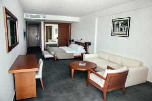 a living room with a couch and a table at Avala Resort & Villas in Budva