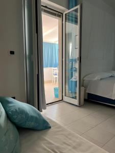 Postel nebo postele na pokoji v ubytování B&B Villa Méditerranée con parking space