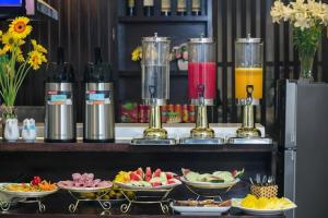 a buffet of food and drinks on a table at Beryl Central Hanoi Hotel in Hanoi